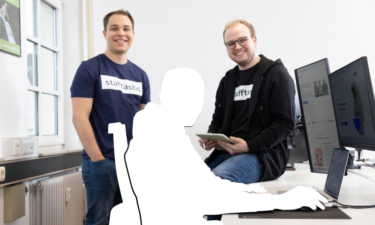 Stafftastic team gathered with a silhouette placeholder, symbolizing an open position.