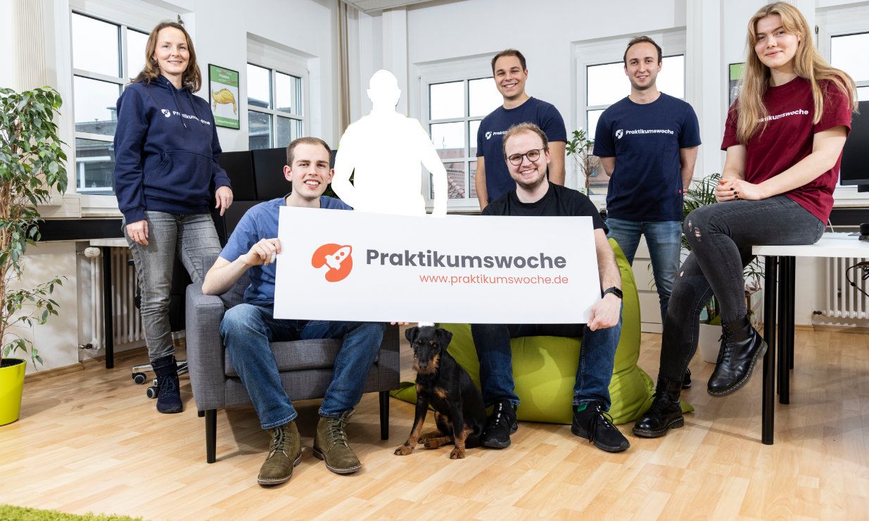 Stafftastic team gathered with a silhouette placeholder, symbolizing an open position.